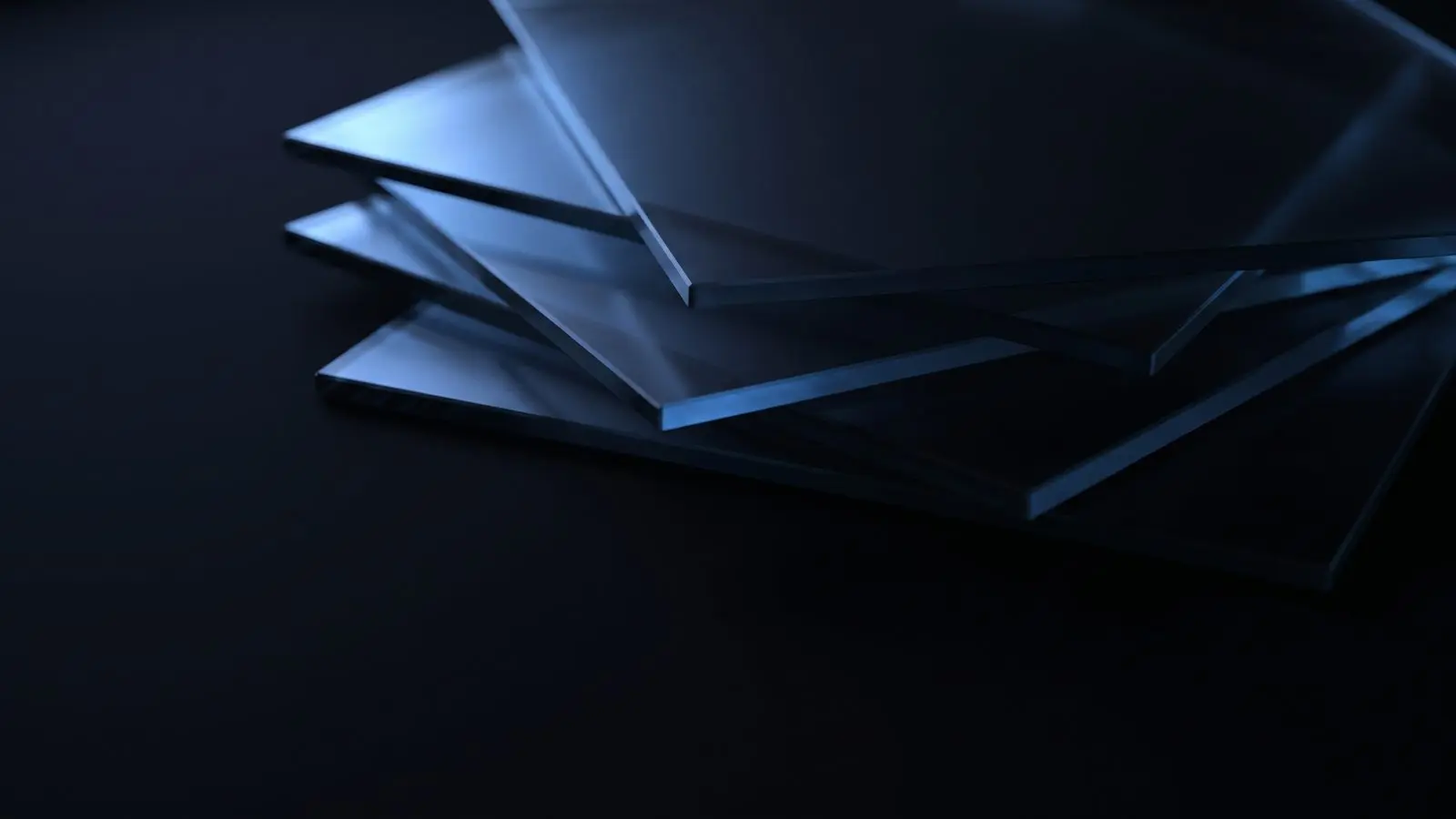 Stacked translucent glass sheets with blue light passing through them.